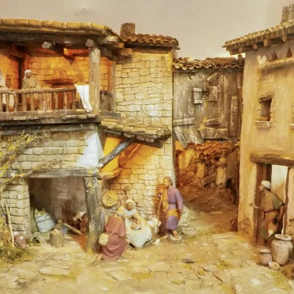 Adoración de los pastores en pueblo en ruinas